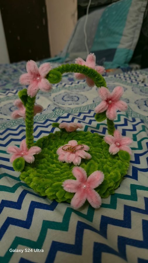 Garden Arch Ring Tray. Handcrafted ring holder made from soft chenille wire, with a green moss-textured base, a flowered arch, and pink blossoms with pearl centers. A pretty display for rings and small jewelry, and a…